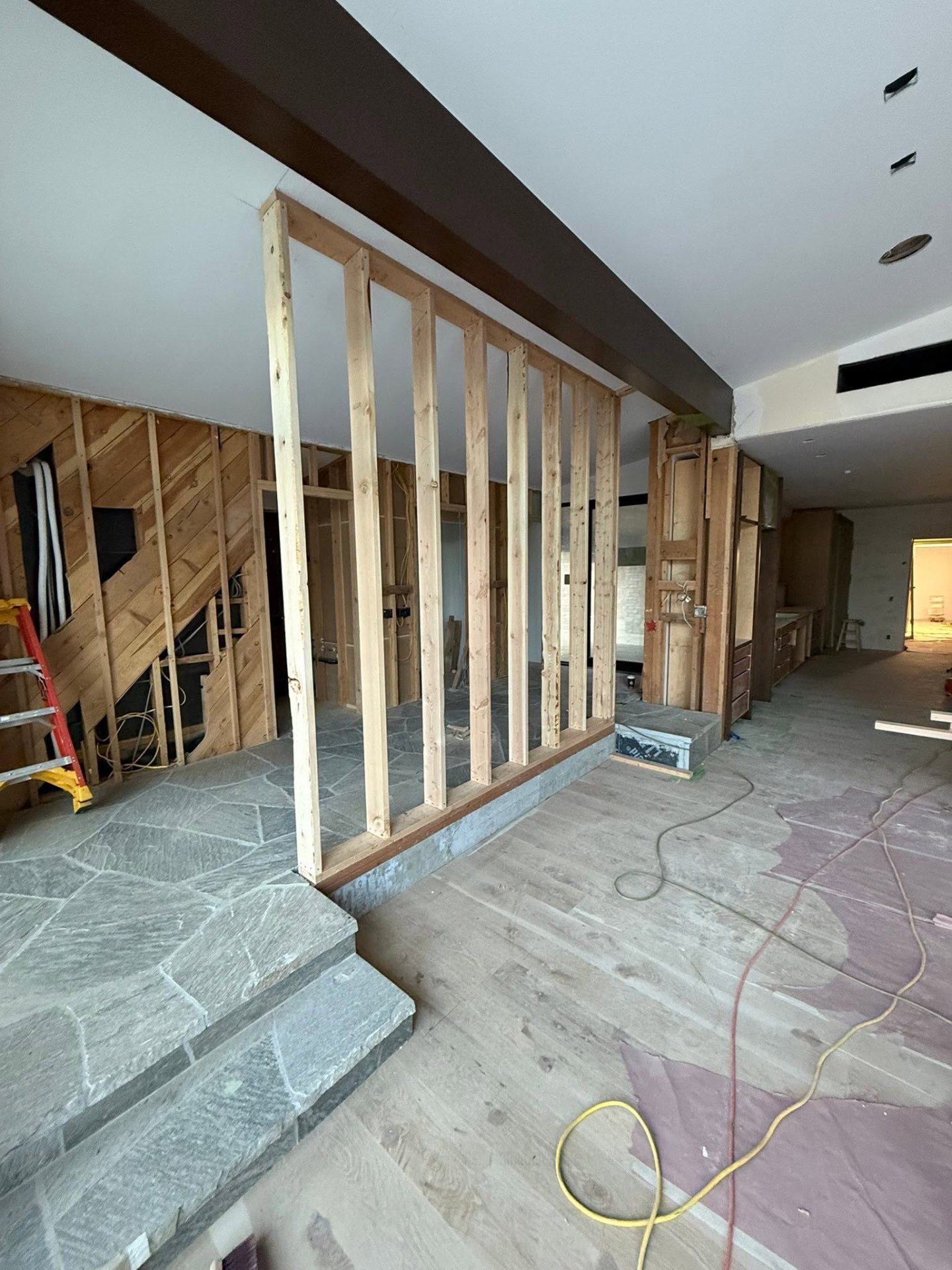 Interior framing and flagstone entryway during remodel