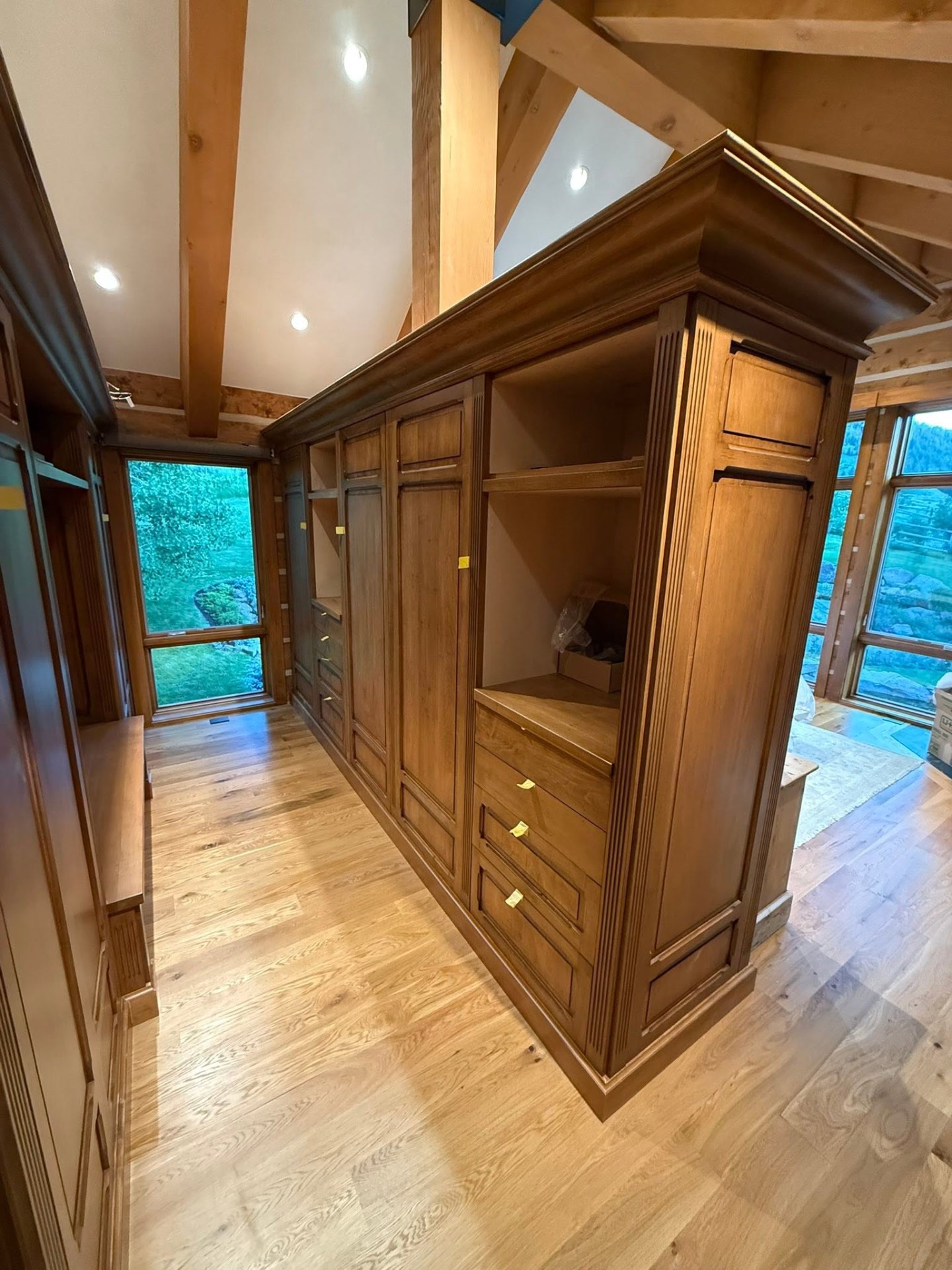 Custom wood cabinetry and finish carpentry with vaulted beams