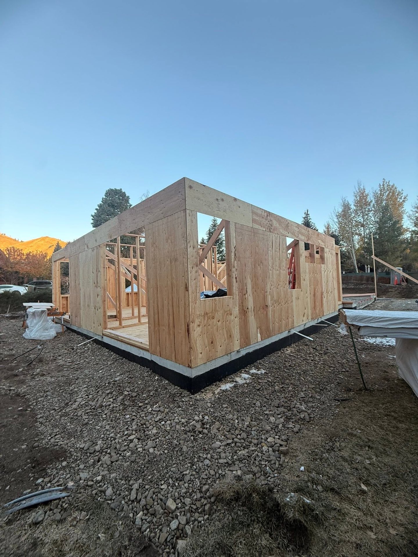New home framing at sunrise in the Wood River Valley